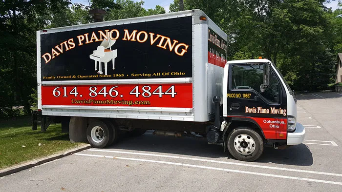 Piano moving box truck parked on a lot